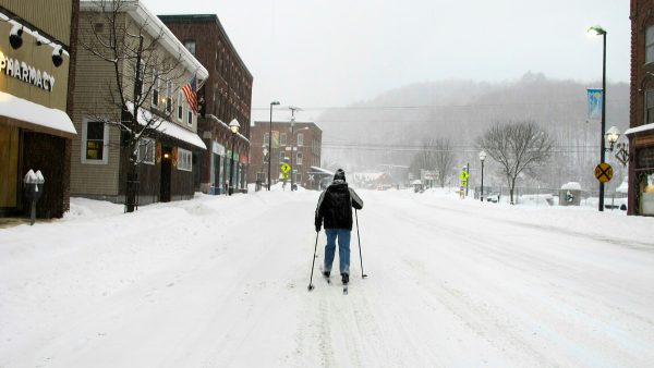 Bill Moore cross-country skis down a street on Jan. 20