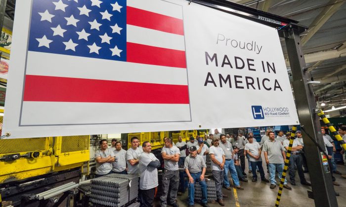 Workers at the Hollywood Bed Frame Company attend an event to mark the company's upcoming expansion which will double the manufacturer's workforce, adding 100 new local jobs, at the company's factory in Commerce, Calif., seven miles southeast from downtown Los Angeles on April 14, 2017. (Robyn Beck/AFP/Getty Images)