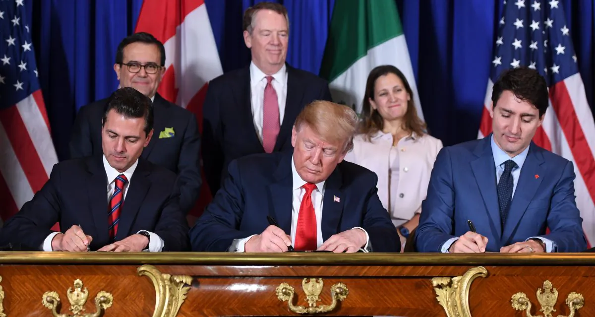 Mexico's President Enrique Peña Nieto (L), President Donald Trump (C), and Canadian Prime Minister Justin Trudeau sign the USMCA agreement in Buenos Aires on Nov. 30, 2018. (Saul Loeb/AFP/Getty Images)