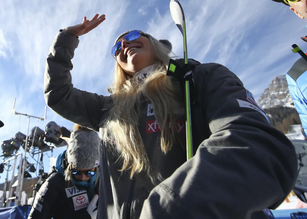 United States' Lindsey Vonn waves as she stands in the finish area after completing an alpine ski, women's World Cup super-G in Cortina D'Ampezzo, Italy, on Jan. 20, 2019. (Alessandro Trovati/AP)