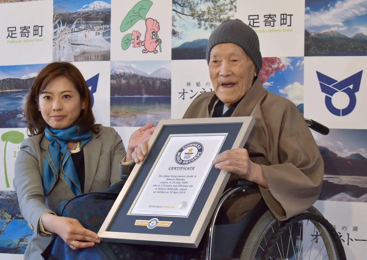 File—Masazo Nonaka receiving a certificate for the Guinness World Records oldest man living title at a ceremony in Ashoro, Japan, on April 10, 2018. Nonaka died on Jan. 20, 2019, aged 113. (Jiji Press/AFP/Getty Images)
