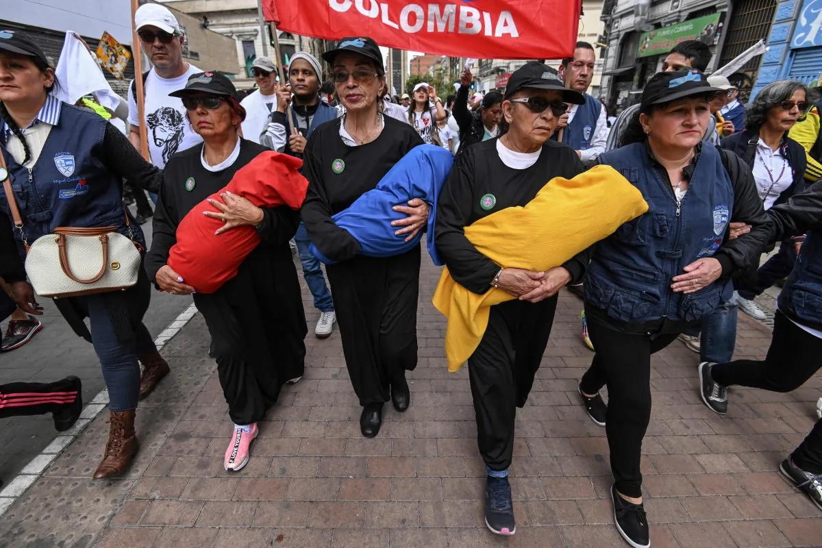 Demonstrators take part in a march against terrorism, in repudiation of the police academy recent car bombing, and in support of the victims and their relatives, on Jan. 20, 2019. (Juan Barreto/AFP/Getty Images)