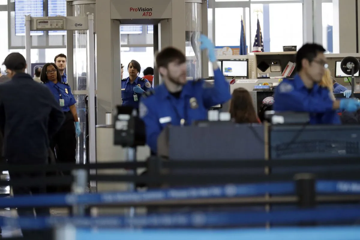 Transportation Security Administration officers work at a checkpoint at O'Hare airport in Chicago on Jan. 5, 2019. (AP Photo/Nam Y. Huh, File)
