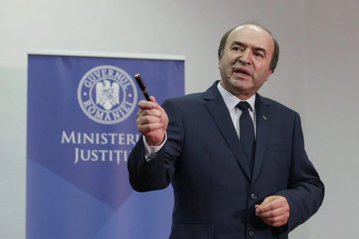 Romanian Justice Minister Tudorel Toader gestures while talking to media representatives minutes before delivering a news conference in Bucharest, Romania, on Feb. 22, 2018. (Octav Ganea/Reuters)