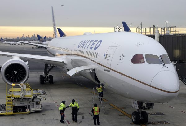 a plane is being serviced in Newark