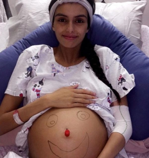 Brianna shows her pregnant belly