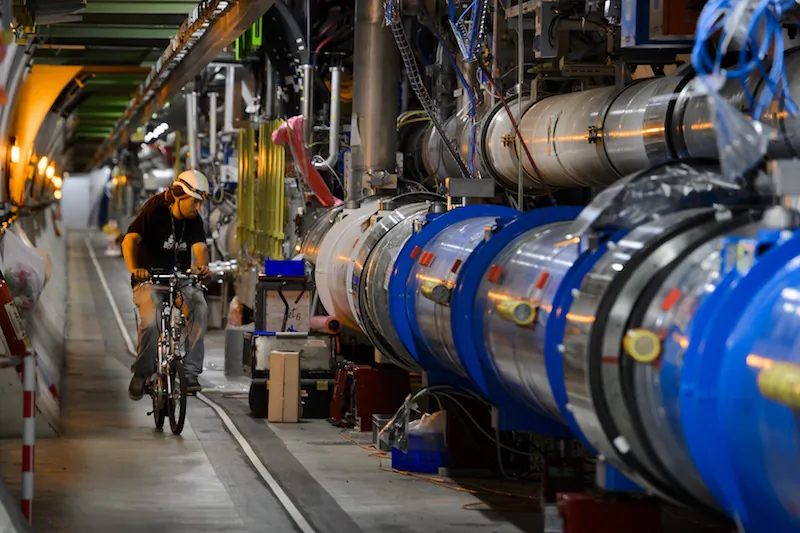 A worker rides on his bicycle in the CERN's Large Hadron Collider (LHC) tunnel during maintenance works in Meyrin, near Geneva on July 19, 2013. (Fabrice Coffrini/AFP/Getty Images)