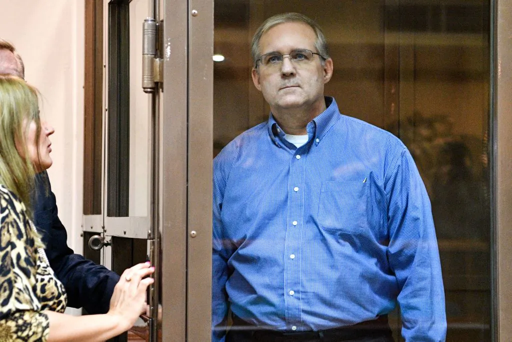 Paul Whelan, a former US Marine accused of espionage and arrested in Russia, listens to his lawyers while standing inside a defendants' cage during a hearing at a court in Moscow on Jan. 22, 2019. (Mladen Antonov/AFP/Getty Images)