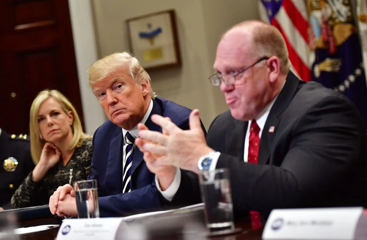 President Donald Trump holds a law enforcement roundtable on sanctuary cities with Homeland Security Secretary Kirstjen Nielsen (L) and Thomas Homan, acting director of Immigration and Customs Enforcement. Photo by Kevin Dietsch-Pool/Getty Images