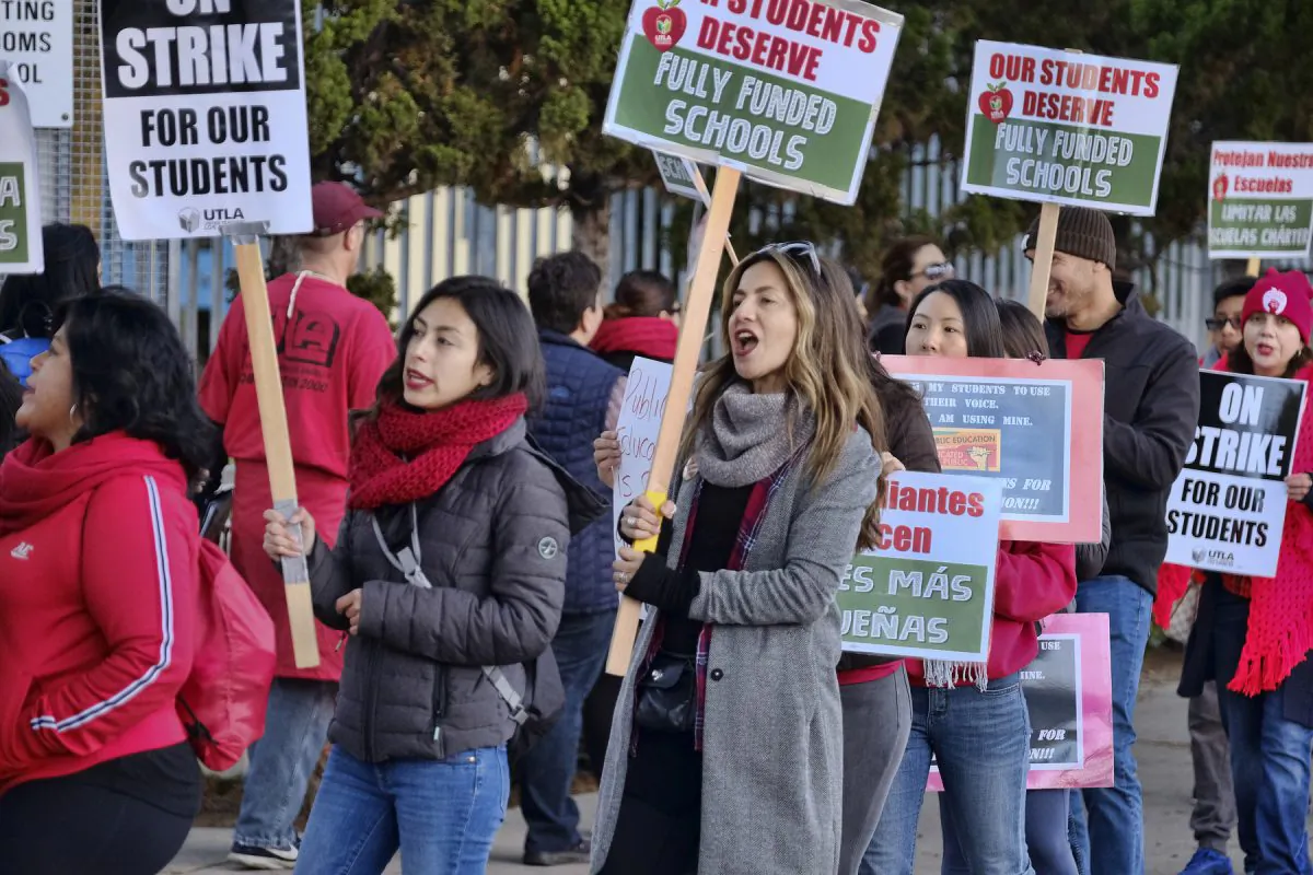 Striking Los Angeles Unified District teachers are joined by parents and students in front of Evelyn Thurman Gratts Elementary School in L.A., on Jan. 22, 2019. (Richard Vogel/AP)