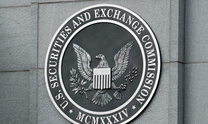 The U.S. Securities and Exchange Commission seal hangs on the facade of its building in Washington on Sept. 18, 2008. (Chip Somodevilla/Getty Images)