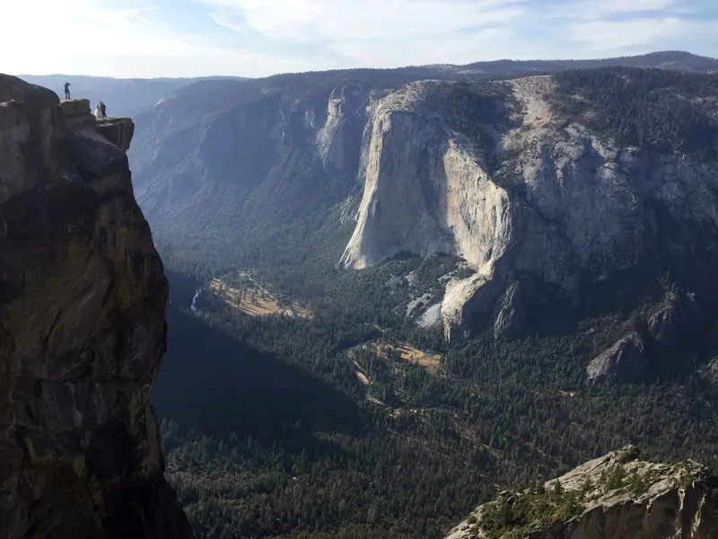 In this Thursday, Sept. 27, 2018 file photo, an unidentified couple gets married at Taft Point, upper left, in California's Yosemite National Park. A Northern California coroner says a young couple from India was intoxicated when the pair fell to their deaths from the scenic overlook in Yosemite. Autopsy reports provided by the Mariposa County sheriff's department Friday, Jan. 18, 2019 concluded that 30-year-old Meenakshi Moorthy and her husband, 29-year-old Vishnu Viswanath, were both "intoxicated with ethyl alcohol prior to death." (AP Photo/Amanda Lee Myers, File)