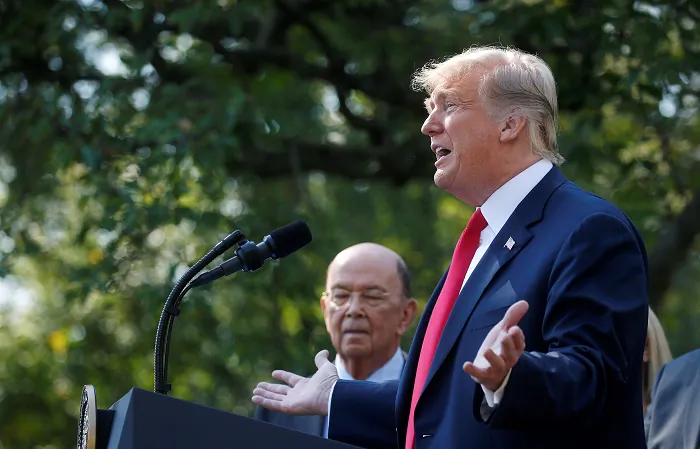 President Donald Trump announces the United States-Mexico-Canada Agreement (USMCA) as U.S. Commerce Secretary Wilbur Ross looks on during a news conference in the Rose Garden of the White House in Washington, on Oct. 1, 2018. (Leah Millis/Reuters File Photo)