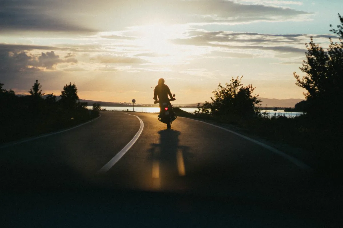 A motorcyclist enjoying the open road. (Pexels)
