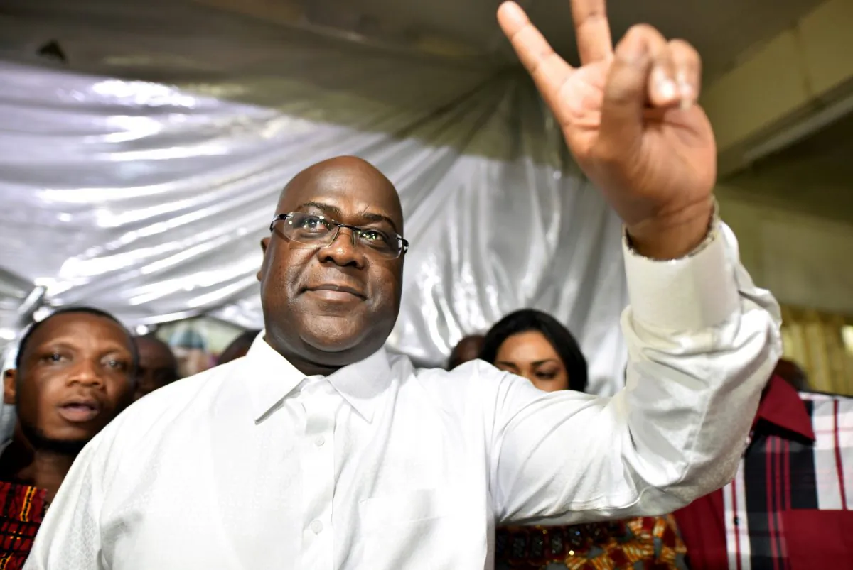 Felix Tshisekedi, leader of the Congolese main opposition party, the Union for Democracy and Social Progress, gestures to supporters at party headquarters in Kinshasa, Democratic Republic of Congo, Jan. 10, 2019. (Reuters/Olivia Acland/File Photo)