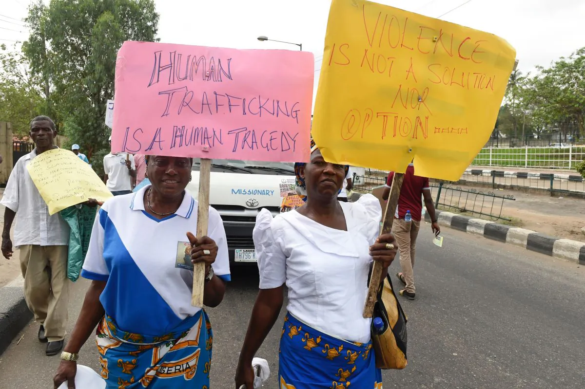 Women carry placards during a march against violence and human trafficking on March 18, 2017 in Lagos, Nigeria. (Pius Utomi Ekpei/AFP/Getty Images)