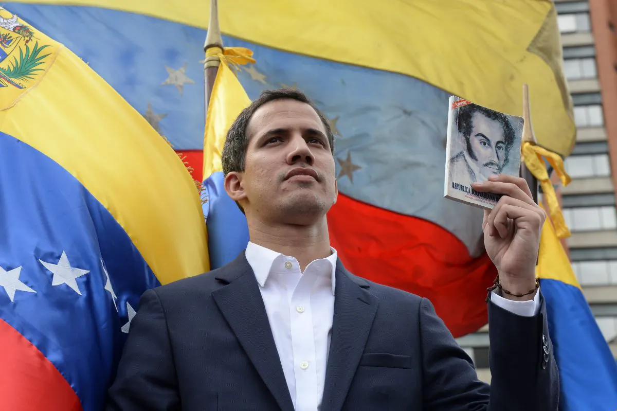 Venezuela's National Assembly head Juan Guaido declares himself acting president during a mass opposition rally in Caracas on Jan. 23, 2019, against leader Nicolas Maduro on the anniversary of the 1958 uprising that overthrew the country’s military dictatorship. (Federico Parra/AFP/Getty Images)