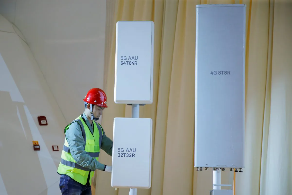 A staff member displays 5G active antenna units during a product presentation in Beijing on Jan. 24, 2019. (REUTERS/Thomas Peter)
