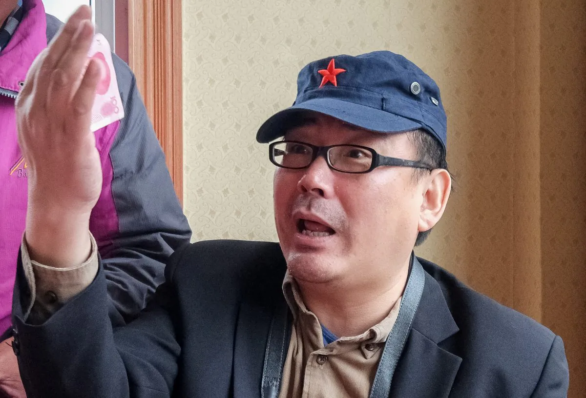 Yang Hengjun, author and former Chinese diplomat, who is now an Australian citizen, gestures in an unspecified location in Tibet, China, sometime in mid-July, 2014. (Reuters)