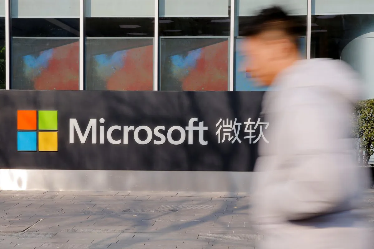 A man walks past the office of Microsoft in Beijing on Jan. 24, 2019. (Thomas Peter/Reuters)
