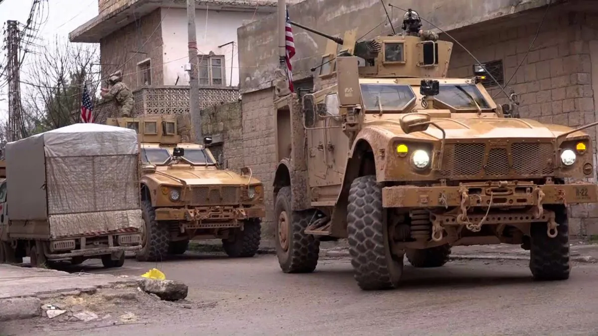 An image grab taken from a video obtained by AFPTV on Jan. 16, 2019, shows US armored vehicles at the scene of a suicide attack in the northern Syrian town of Manbij. (-/AFP/Getty Images)