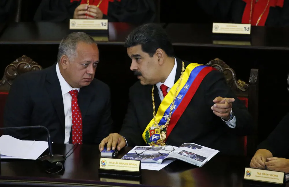 Venezuelan President Nicolas Maduro, right, speaks with Constitutional Assembly President Diosdado Cabello at the Supreme Court during an annual ceremony that marks the start of the judicial year in Caracas, Venezuela, on Jan. 24, 2019. (Ariana Cubillos/AP Photo)