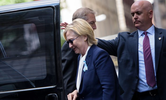 Then-Democratic presidential nominee Hillary Clinton gets in her car while leaving her daughter's apartment building in New York City on Sept. 11, 2016. (BRENDAN SMIALOWSKI/AFP/Getty Images)