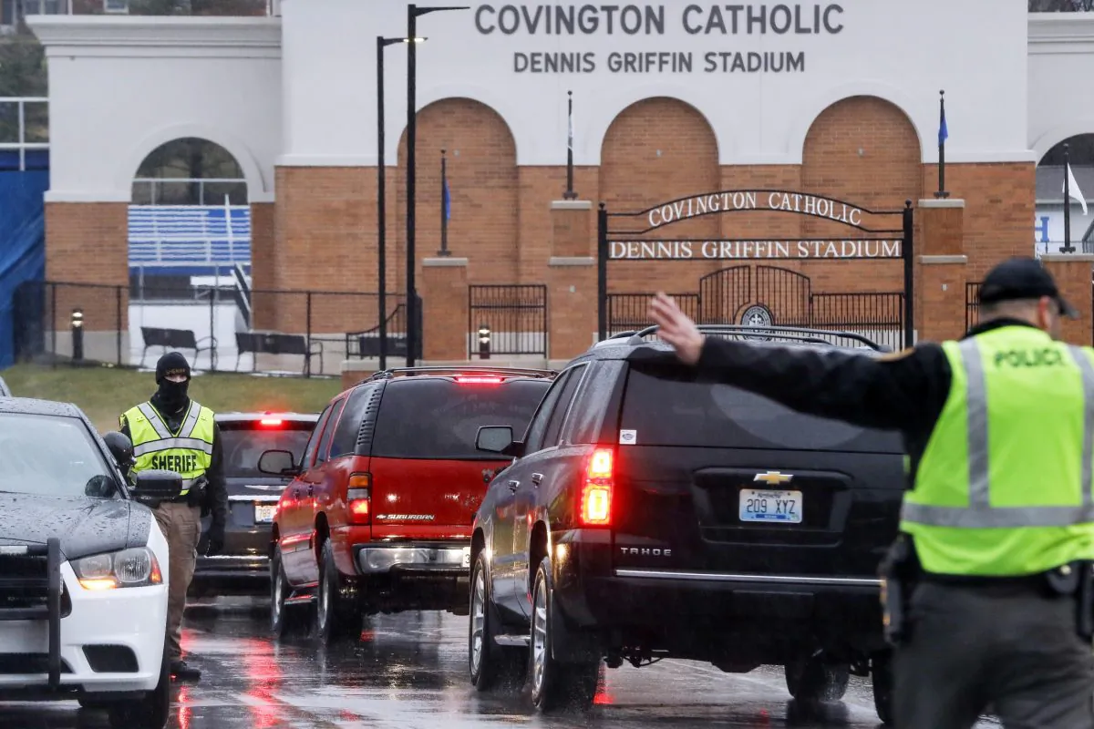 Students arrive at Covington Catholic High School as classes resume following a closing due to security concerns the previous day in Park Hills, Ky., on Jan. 23, 2019. Local police authorities controlled access to the property at entrances and exits. (John Minchillo/AP Photo)