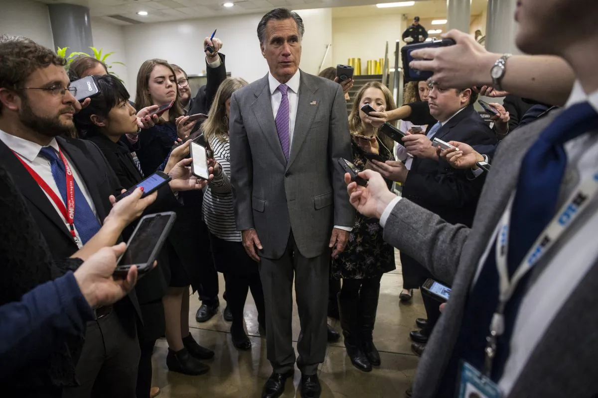 Sen. Mitt Romney (R-Utah) speaks to reporters near the Senate Subway on Capitol Hill on Jan. 24, 2019. (Zach Gibson/Getty Images)