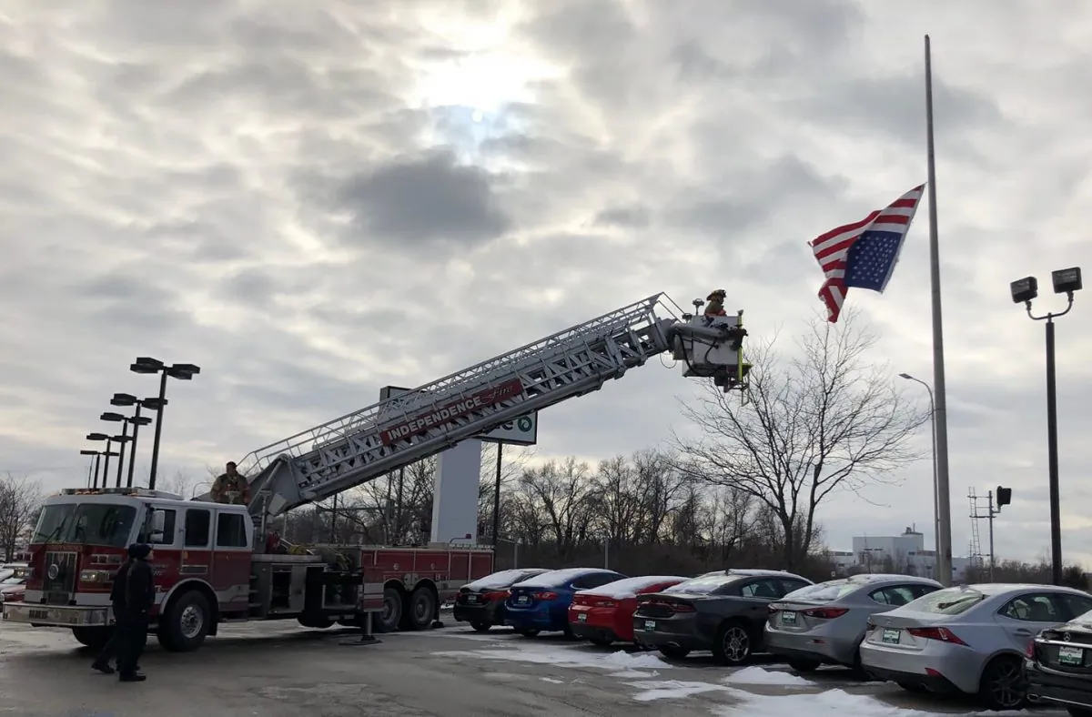 Firefighters fix an upside-down American flag on Jan. 19, 2019. (Independence Police Department)