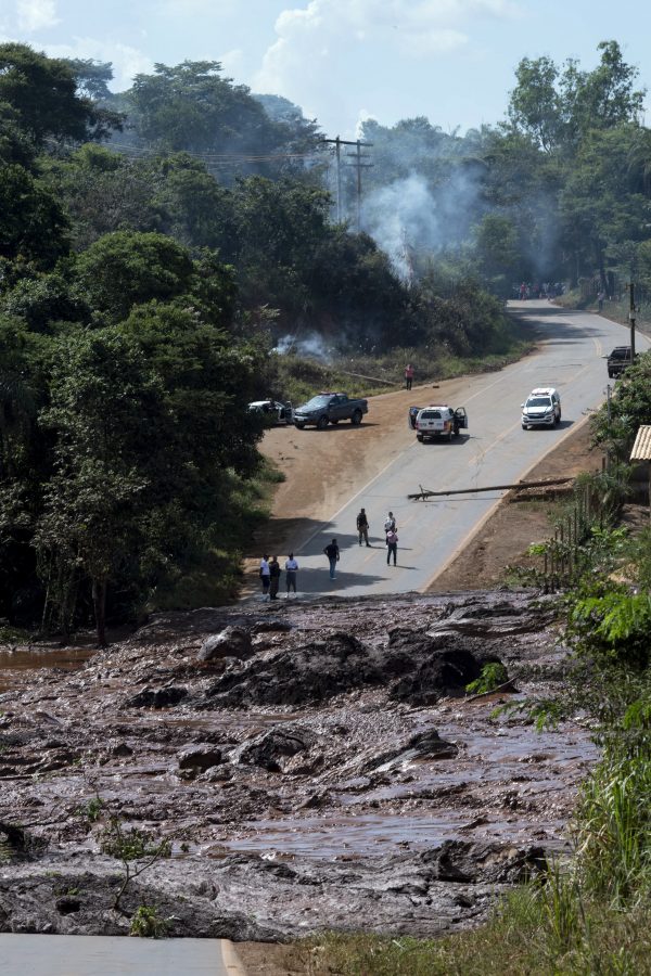 A road is blocked after a dam collapsed