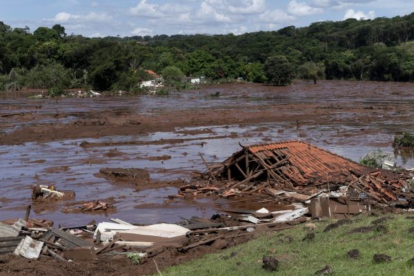 A structure lays in ruins after a dam collapsed