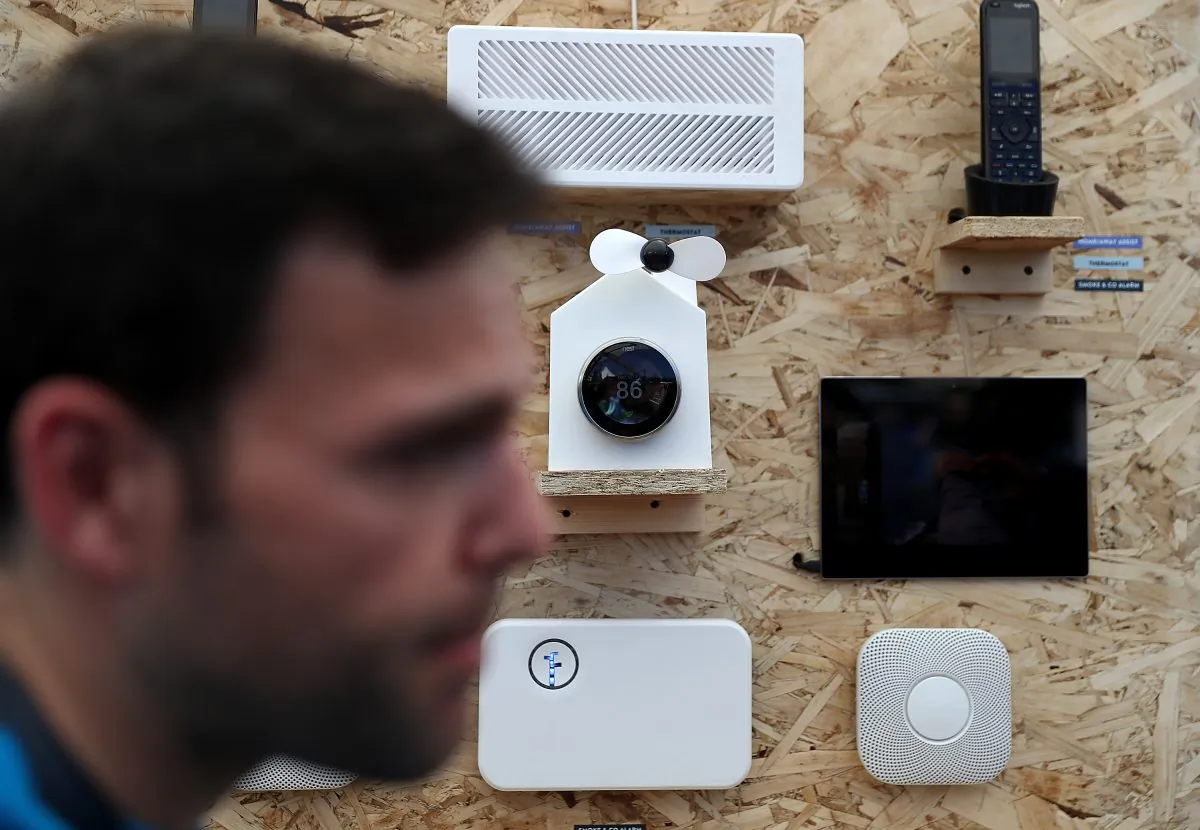 An attendee looks at a display of Nest products during Google I/O 2016 at Shoreline Amphitheatre in Mountain View, Calif., on May 19, 2016. (Photo by Justin Sullivan/Getty Images)