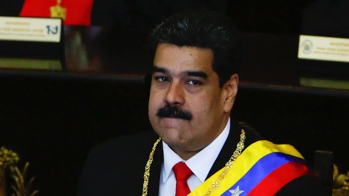 Venezuelan dictator Nicolás Maduro (L) looks on before talking to judges and members of the Supreme Justice Tribunal on its annual opening day of sessions in Caracas, Venezuela, on Jan. 24, 2019. (Getty Images)