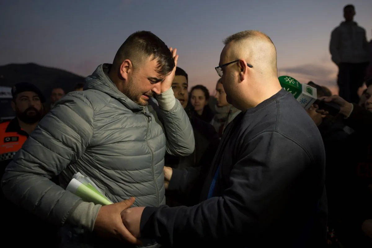 Jose Rosello (L), father of Julen who fell down a well, cries as rescue efforts continue to find the boy in Totalan in southern Spain, on Jan. 16, 2019. (Jorge Guerrero/AFP/Getty Images)