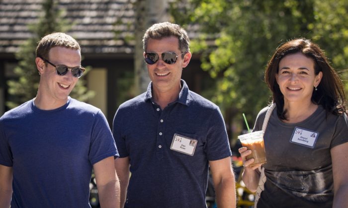 Mark Zuckerberg, CEO of Facebook, Dan Rose, VP, partnerships at Facebook, and Sheryl Sandberg, COO of Facebook, attend the annual Allen & Company Sun Valley Conference in Sun Valley, Idaho on July 12, 2018. (Drew Angerer/Getty Images)