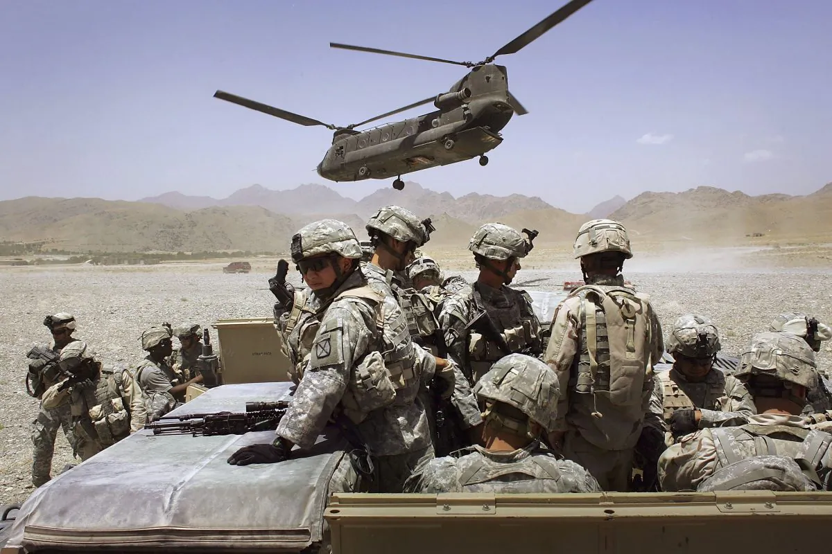 American soldiers from the 10th Mountain Division deploy to fight Taliban fighters as part of Operation Mountain Thrust to a U.S. base near the village of Deh Afghan in the Zabul Province of Afghanistan on June 22, 2006. (John Moore/Getty Images)