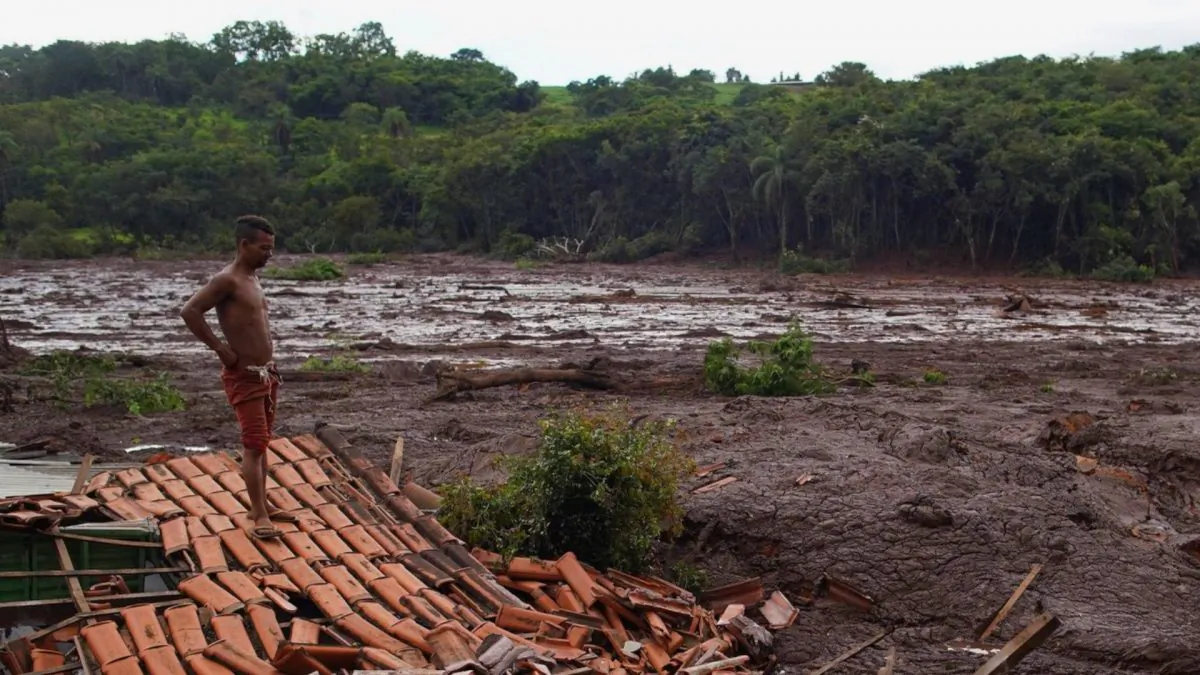 Emerson dos Santos stands on the remains of his mother's house in Brumadinho, Brazil, on Jan. 26, 2019. (Leo Correa/AP)