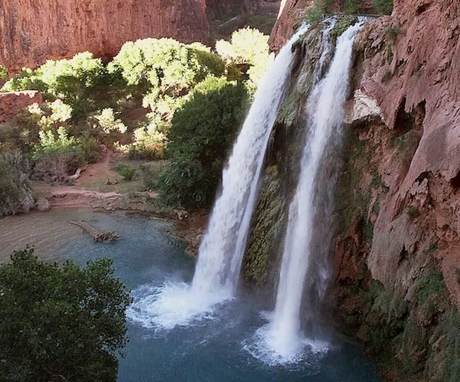 This 1997 file photo shows one of five waterfalls on Havasu Creek as its waters tumble 210 feet on the Havasupai Tribe's reservation in a southeastern branch of the Grand Canyon near Supai, Ariz. (AP Photo/Bob Daugherty)