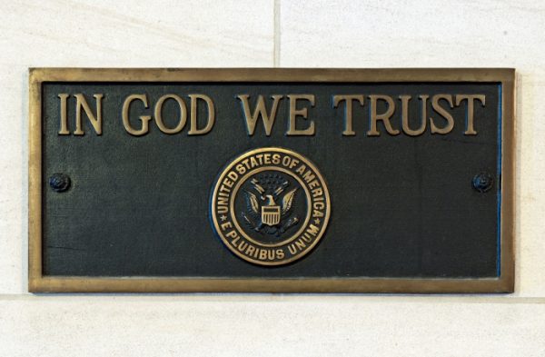 In God We Trust plaque.