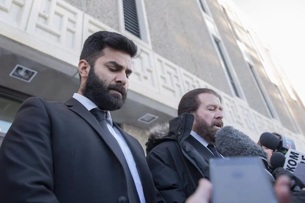 Jaskirat Singh Sidhu (L) and his lawyer. (The Canadian Press)