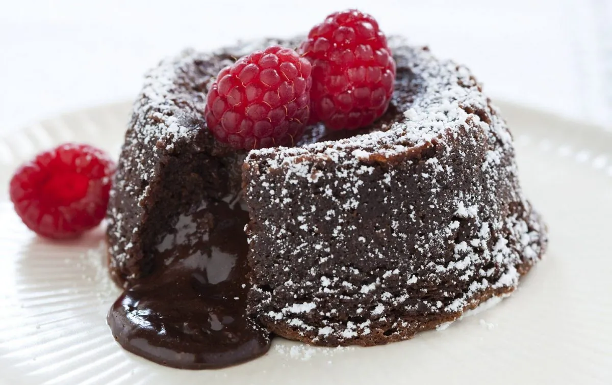 A Fallen Chocolate Cake in Brookline, Mass. This recipe appears in the cookbook "The Perfect Cake." (Keller + Keller/America's Test Kitchen via AP)