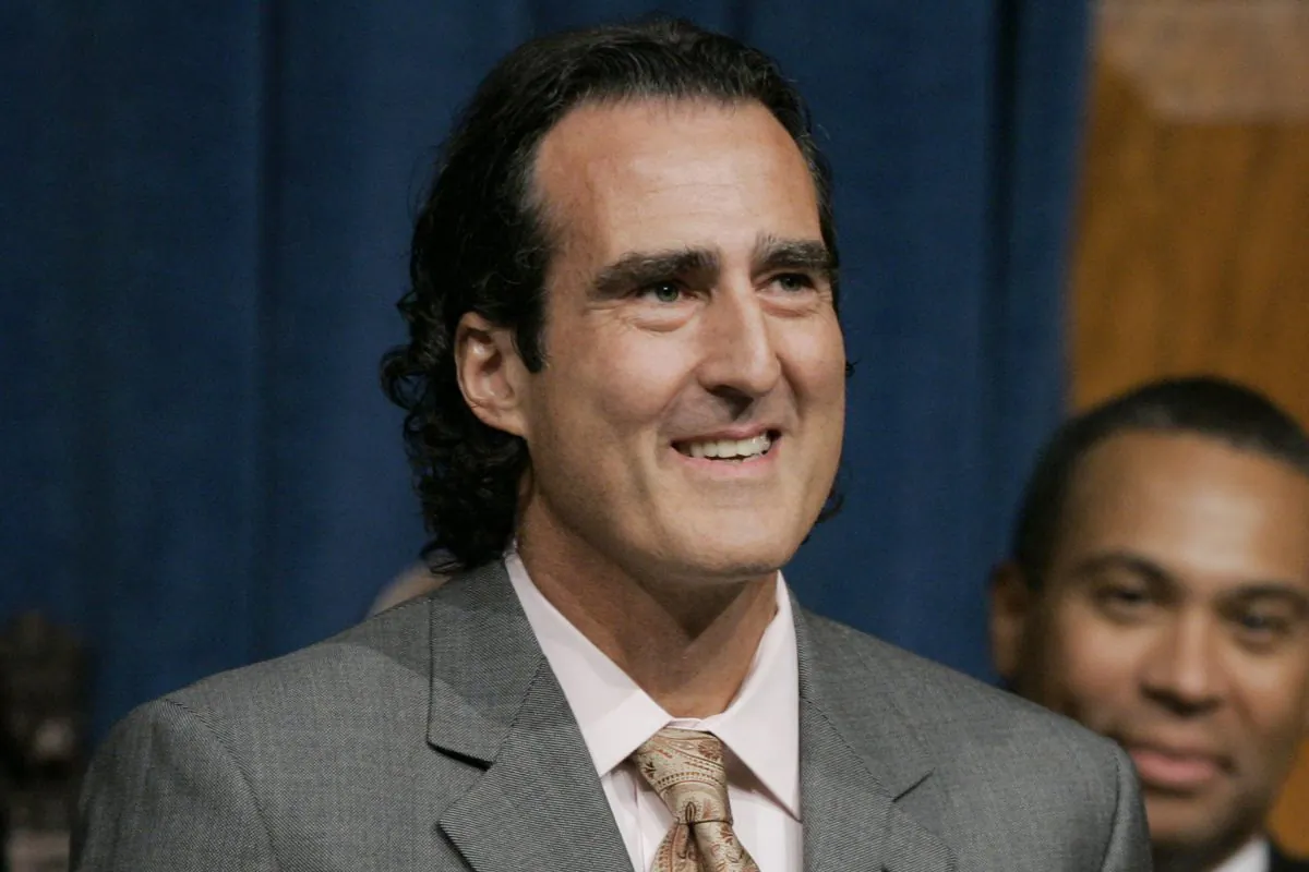 In this file photo, Nobel Prize-winning scientist Craig Mello, front, acknowledges applause from members of the Massachusetts House and Senate on the floor of the House Chamber at the Statehouse in Boston on July 19, 2007. (AP Photo/Steven Senne, File)
