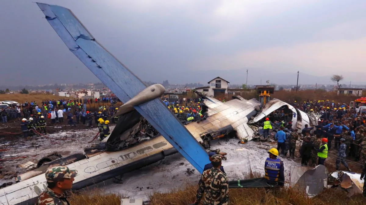 Rescue workers work at the wreckage of a US-Bangla airplane after it crashed at the Tribhuvan International Airport in Kathmandu, Nepal, on March 12, 2018. (Navesh Chitrakar/Reuters)