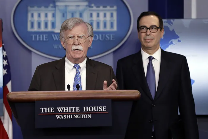National security adviser John Bolton (L) and Treasury Secretary Steven Mnuchin during a press briefing at the White House, on Jan. 28, 2019. (Evan Vucci/AP Photo)