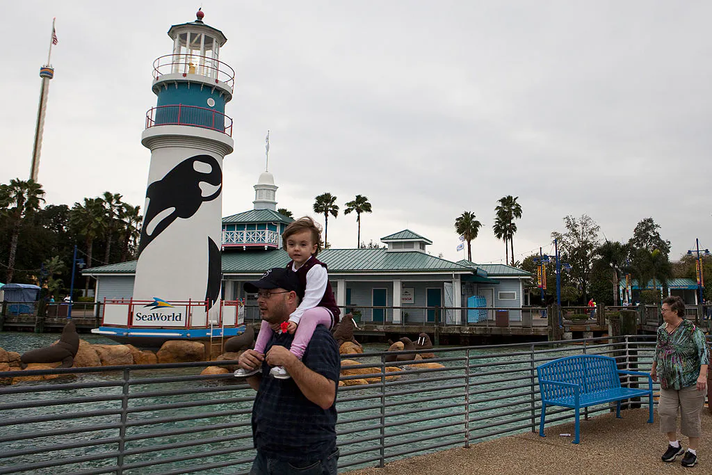 Guests exit the park at the end of the day at SeaWorld in Orlando, Florida on Feb. 24, 2010. (Photo by Matt Stroshane/Getty Images)