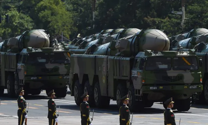 Military vehicles carrying DF-21D missiles are displayed in a military parade at Tiananmen Square in Beijing on Sept. 3, 2015. (Greg Baker/AFP/Getty Images)
