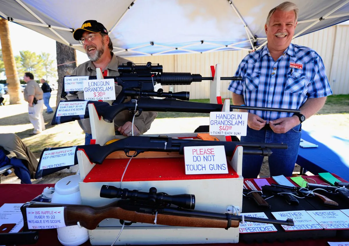 Vendors display hunting rifles for sale at the Crossroads of the West Gun Show at the Pima County Fairgrounds, in Tucson, Ariz., on Jan. 15, 2011.  (Kevork Djansezian/Getty Images)