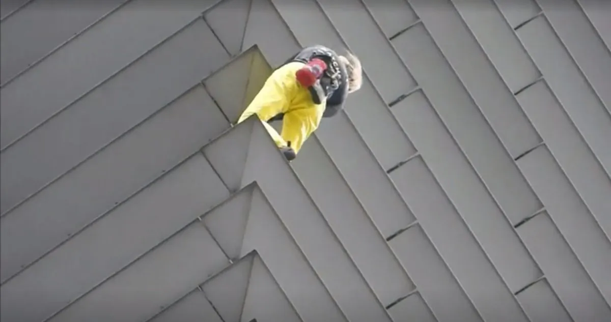 Alain Robert climbs the GT Tower in Manila on Jan. 29, 2019. (Screenshot/Reuters)