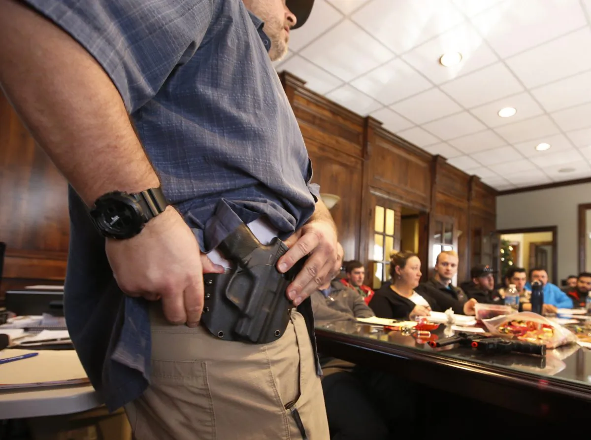 An instructor shows a holster at a gun concealed carry permit class put on by "USA Firearms Training" in Provo, Utah, on Dec. 19, 2015. (George Frey/Getty Images)